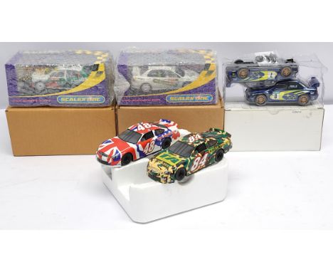 Scalextric, a group of 1:32nd scale Slot Cars to include (1) 2 x C2531 Subaru Impreza; (2) C2645 Skoda Fabia WRC - Colin McRa