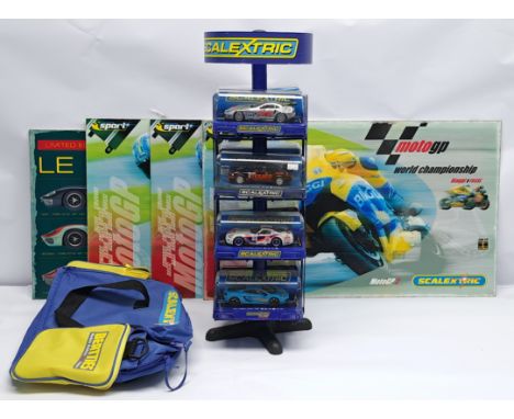 Scalextric, a group of slot cars with Shop Display Stand to include (1) C3010 Mercedes SLR McLaren 722 GT; (2) C3203 Ford Foc