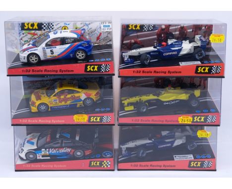 SCX, a group of 1:32nd scale Slot Cars to include (1) 60500 Ford Focus "Costa Brava 2000"; (2) 60820 Audi TT-R "Norburgring 2
