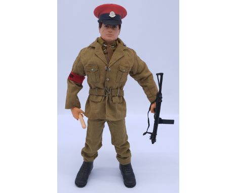Palitoy Action Man vintage loose Royal Military Police figure, dark flock hair, gripping hands, wearing jacket, trousers, shi