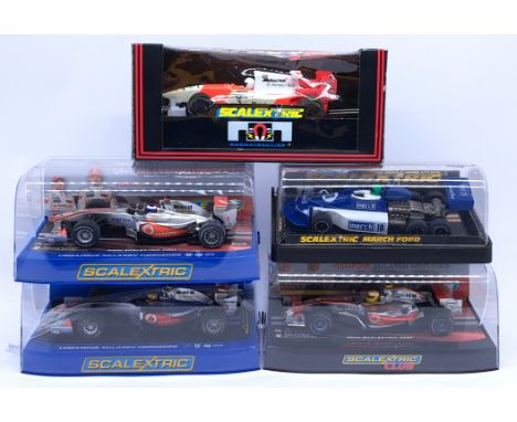 Scalextric, a group of 1:32nd Scale Slot Racing Cars to include (1) C2880 McLaren MP4-21 - Lewis Hamilton; (2) C3046 Vodafone