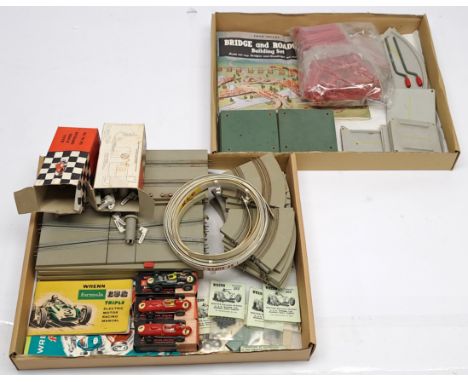 Wrenn 'Formula 152 loose Racing Car set, comprising straight and curved track sections, fencing, fence posts, spare parts and