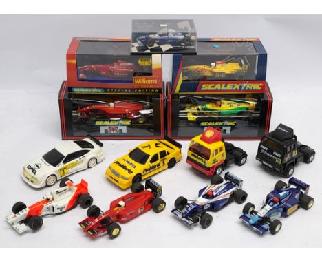 A group of 1:32nd scale boxed and loose Racing Slot Cars to include (1) Scalextric C2080 Jordan F1; (2) Scalextric C2162 Will