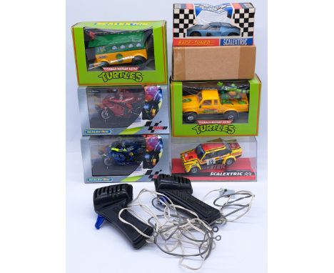 A mixed group of Slot vehicles to include (1) Scalextric C77 Ford GT (includes transit carton); (2) Scalextric C6005 Moto GP 