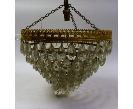 A ceiling light applied with concentric rings of faceted droplets