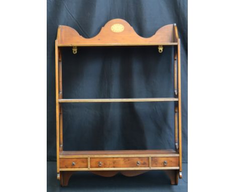 A yew wood three tier shelf unit