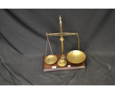 A set of early 19th century brass balance scales and weights
