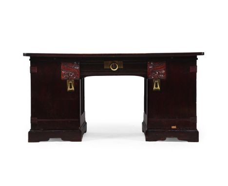 AUSTRIAN SECCESSIONIST KNEEHOLE DESK; LATE 19TH/EARLY 20TH CENTURY  Oak, brass handles The doors enclosing shelves and slidin