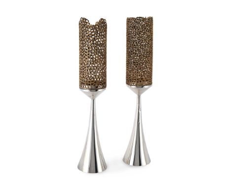 STUART DEVLIN (AUSTRALIAN, 1931-2018) A PAIR OF CANDLESTICKS, 1972Silver trumpet shaped bases, with silver-gilt filigree shad