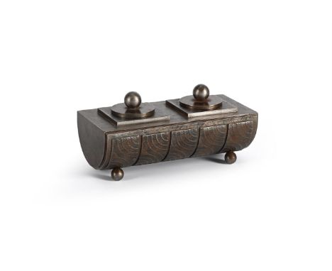 EDGAR BRANDT (FRENCH, 1880-1960) TWIN INKWELL; CIRCA 1930 Cast iron, of demi-cylindrical form, with geometric details, raised