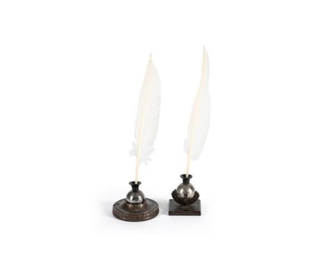 EDGAR BRANDT (FRENCH, 1880-1960) TWO INKWELLS; CIRCA 1930 Cast iron, one circular and one squared mount, with 'sphero-meteore