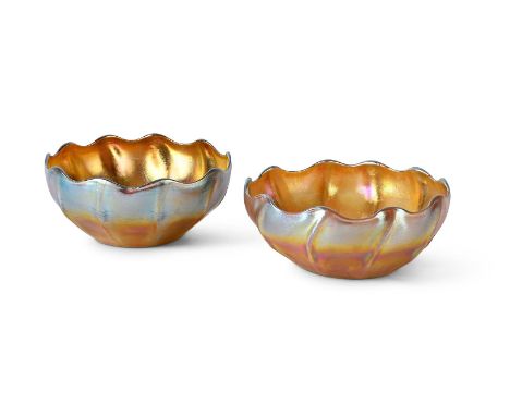 LOUIS COMFORT TIFFANY (AMERICAN, 1848-1933) PAIR OF 'FAVRILE' GLASS BOWLS; EARLY 20TH CENTURY Gold iridescent glass  Engraved
