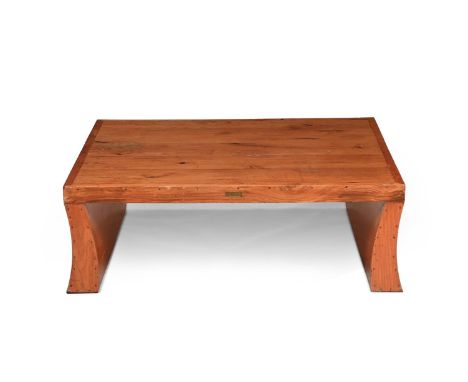 MICHAEL D'SOUZA (B.1959) COFFEE/LOW TABLE, MANUFACTURED BY MUFTI, EARLY 21ST CENTURY Larch, rectangular form, with gentle swe