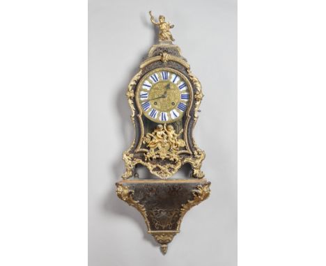 A Louis XV tortoisehell and cut-brass inlaid bracket clock and bracketBy Tortin, ParisSurmounted by a cherub holding a flamin