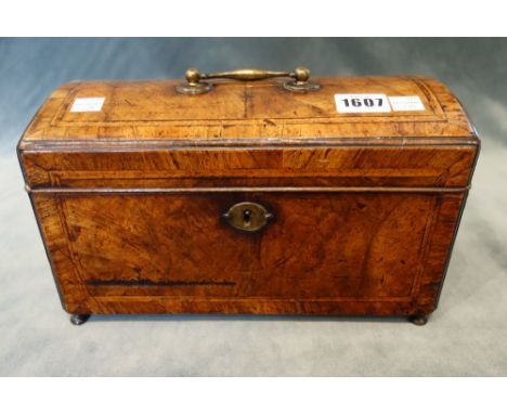 A George II feather banded walnut dome topped tea caddy, lacking interior, 27cm wide x 15cm high x 13cm deep.