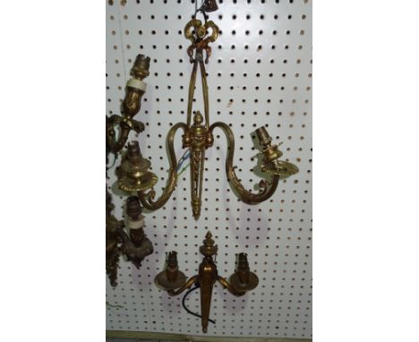 Lighting comprising; a pair of 20th century gilt metal wall lights with ribbon surmounts and two further twin branch wall lig