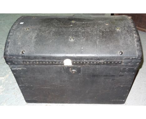 An early 20th century metal studded faux leather domed top trunk, 71cm wide x 55cm high.  K8