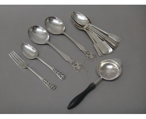 Silver, comprising; eight Victorian fiddle pattern dessert spoons, London 1860, two serving spoons, a dessert spoon and a des