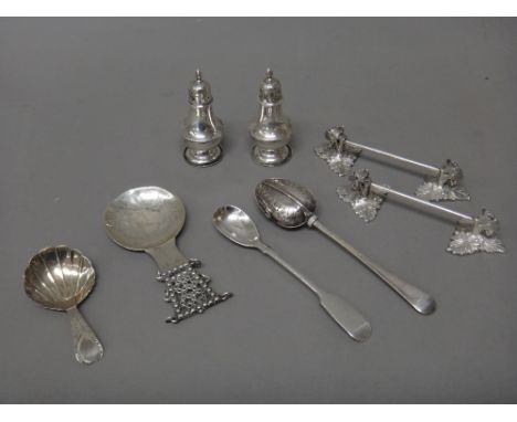 Silver, comprising; a George III tea caddy spoon, having a shell shaped bowl, the handle with bright cut engraved decoration,