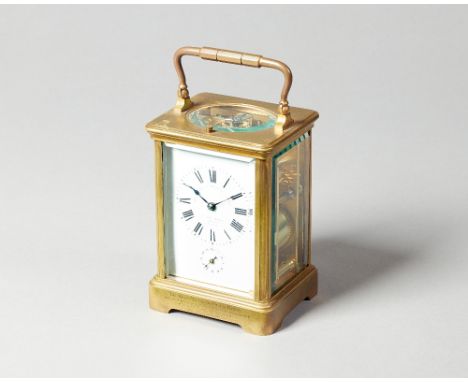 A French brass carriage clockCirca 1910In a corniche case with push/repeat, the white enamel dial inscribed GOLDSMITHS & SILV