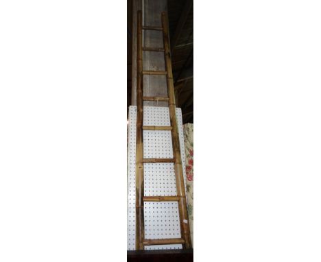 An early 20th century bamboo ladder, 325cm high.  J6