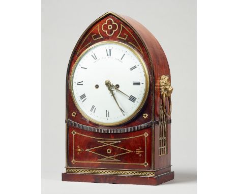 A Regency mahogany and brass line inlaid lancet-shaped mantel clockRetailed by John Grant, Fleet Street, London, the movement