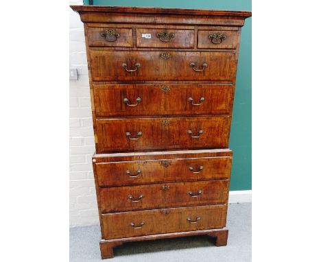 A George II figured walnut chest on chest, with three short over six long graduated drawers, on bracket feet, 105cm wide x 17