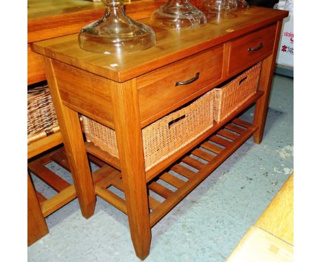 A 20th century oak sideboard, with two drawers and two tier shelf, with two wicker baskets, 120cm wide x 80cm high.  H2