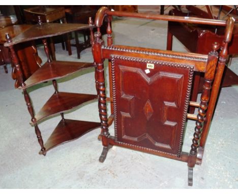 A 20th century oak geometric panel fire screen, together with a mahogany towel rail and a three tier mahogany corner shelf, (