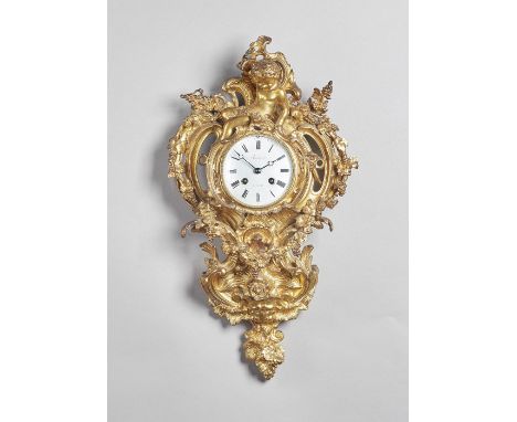 A Napoleon III ormolu cartel clockIn the Louis XV style, circa 1865The case of shaped outline, surmounted by a seated cheub a