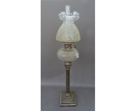 A Victorian and later, silver plated and glass oil lamp, the base of Corinthian column form, with a cut glass reservoir, Dupl