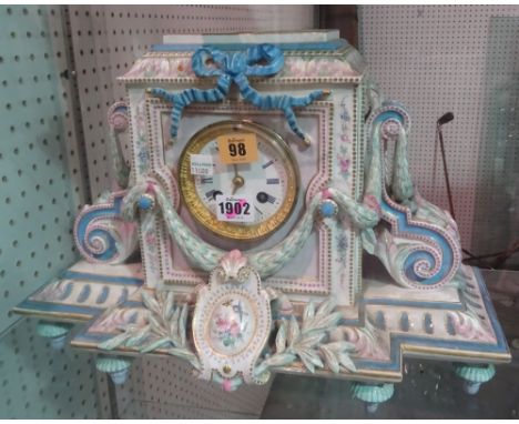 A Paris porcelain mantel clock, circa 1878, the breakfront foliate case enclosing a two train movement with hammer striking a