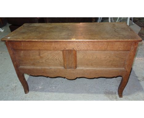 A late 19th century oak lift top trunk, on cabriole supports, 122cm wide x 62cm high.  J2