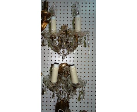 Lighting comprising; a group of seven similar 20th century glass and brass twin branch wall lights, (7).  H10