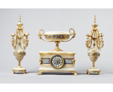   A French ormolu, champleve enamel and onyx clock garnitureIn the Grecian style, circa 1890The clock surmounted by an urn wi