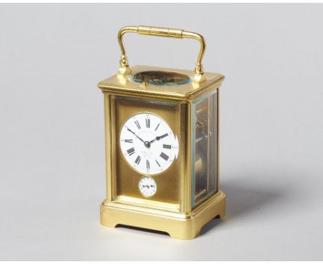 A French gilt brass carriage clockCirca 1910In a corniche case with push/repeat, with bevelled glass panels, the circular whi