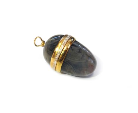 A gold and white enamel mounted, hinged egg shaped pendant, detailed GAGE DE MON AMITIE, the top fitted with a gold suspensio