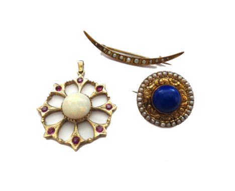 An opal and ruby pendant, in a pierced circular design, mounted with the circular opal at the centre, in a surround of eight 