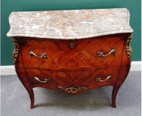 A Louis XV style commode, the serpentine marble top over a gilt metal mounted floral marquetry inlaid bombé Kingwood two draw