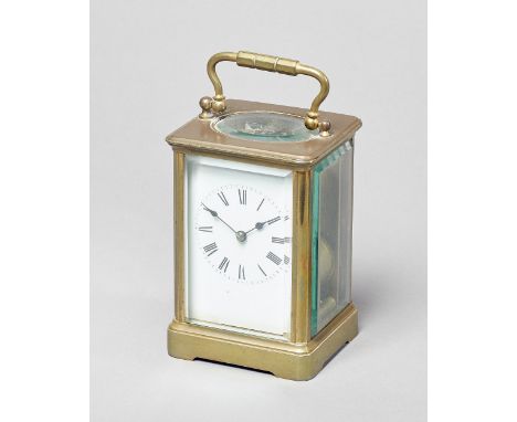 A French brass carriage clockCirca 1900In a corniche case with original silvered platform lever escapement, striking on a gon