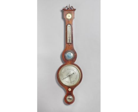 A mahogany and outlined wheel barometerRetailed by J. Pastorelli, 55 Cable Street, LiverpoolThe trunk inset hydrometer, therm