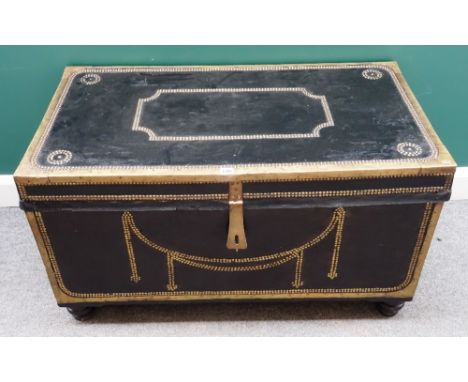 A late 19th century Anglo-Indian leather and studded brass veneered rectangular teak trunk, on bun feet, 105cm wide x 60cm hi