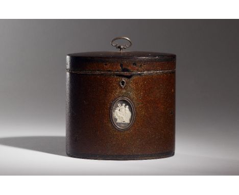 Attributed to Henry Clay; a George III oval tea caddy with ground mother-of-pearl and lacquer finish (Nashiji) and opposing v