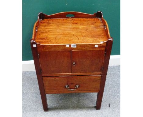 A George III mahogany night commode, the pierced tray top over pair of cupboards and drawer, on square supports, 54cm wide x 