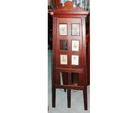 An early 20th century oak Arts and Crafts style seven section photograph frame, formed as an artist's easel, 150cm high.  M6