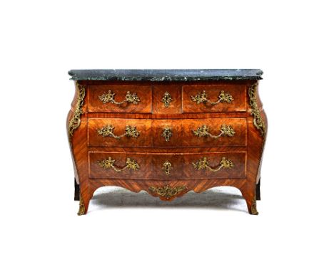 A Louis XV style gilt metal mounted parquetry inlaid Kingwood commode, the serpentine marble top over a bombé base of two sho