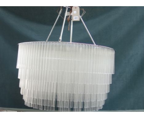 A Tom Kirk glass and chrome chandelier, modern, the circular frame suspending hundreds of clear glass tubes surrounding an in