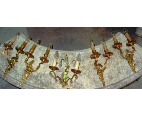 Lighting, including; a group of four 20th century gilt metal twin branch wall lights and another, (5).   C4