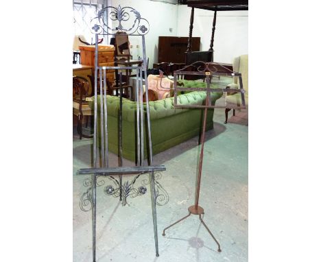 A 20th century wrought iron artist's easel, 59cm wide x 170cm high, an iron reading stand, and a candle holder, (3). E5