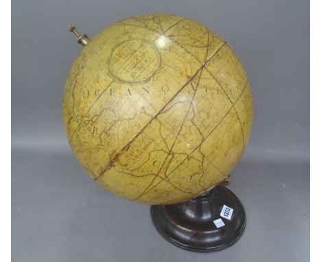 A reproduction table globe labelled 'Globo Terrestre In Roma' on a loaded wooden circular base (a.f), approximately 14 inches